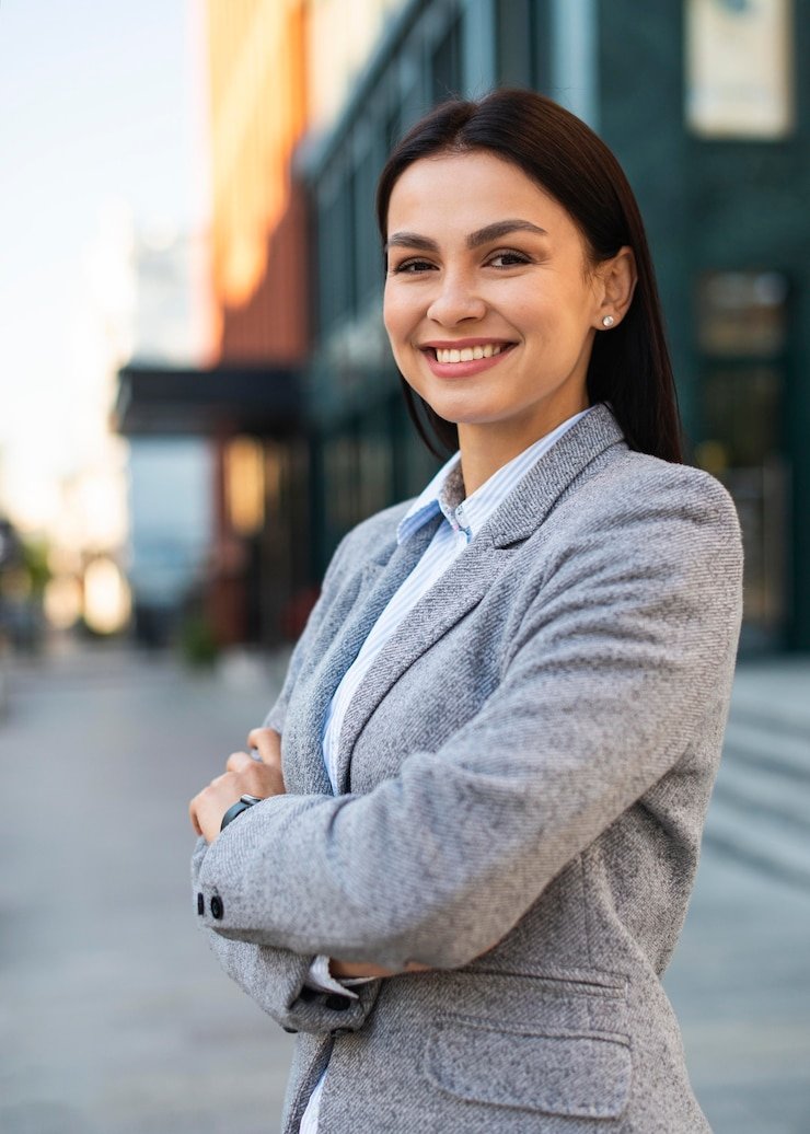 smiley-businesswoman-posing-city-with-arms-crossed_23-2148767033